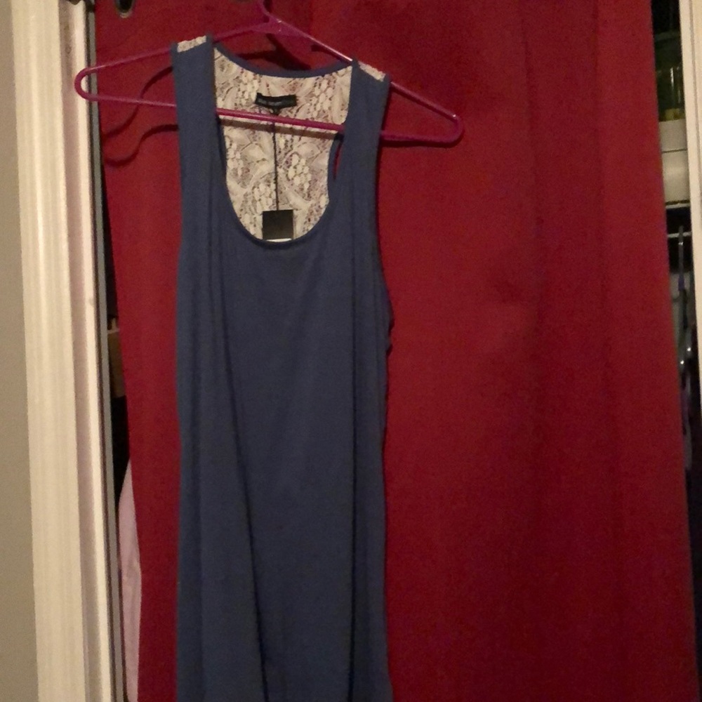 Racer back tee.  Soft material.  Lace backing. Never worn.